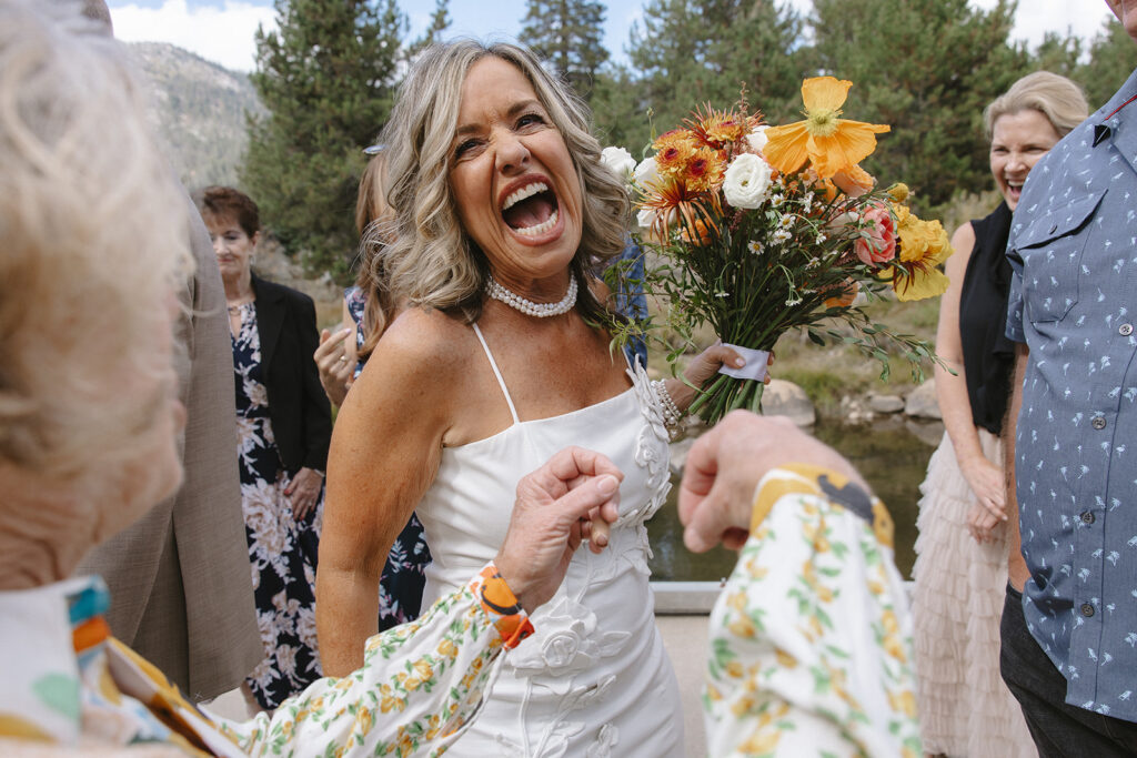 candid desolation hotel wedding ceremony at a fishing platform