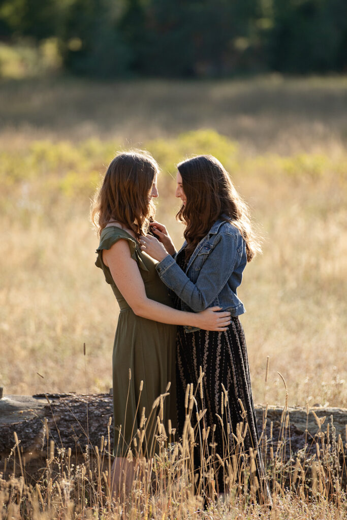 sweet couple in a golden meadow in lake tahoe during their engagement photoshoot