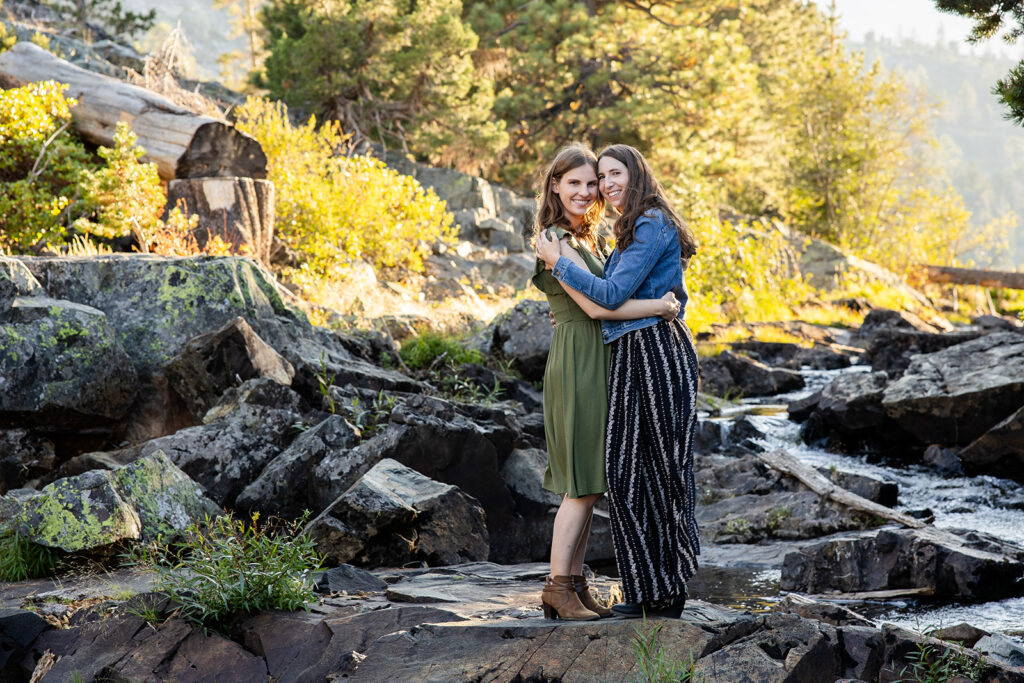 sweet queer couple during their waterfall engagement photos at glen alpine falls