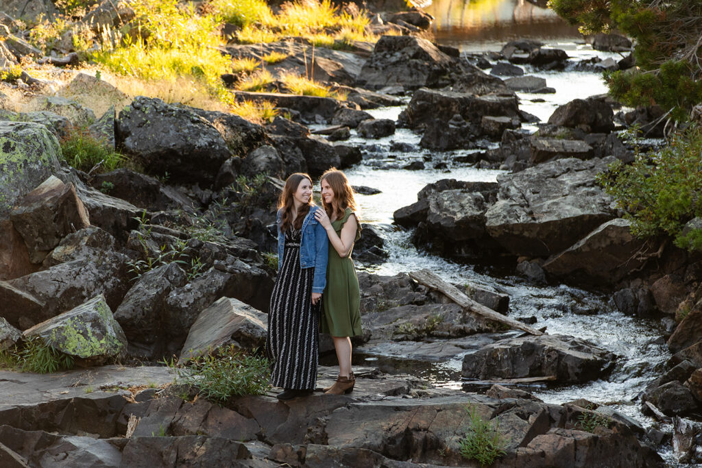 adventurous queer couple surrounded by water views during their Lake Tahoe engagement session