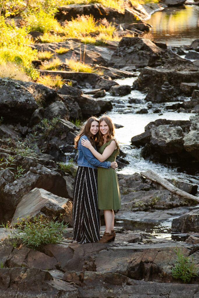 adventurous queer couple surrounded by water views during their Lake Tahoe engagement session