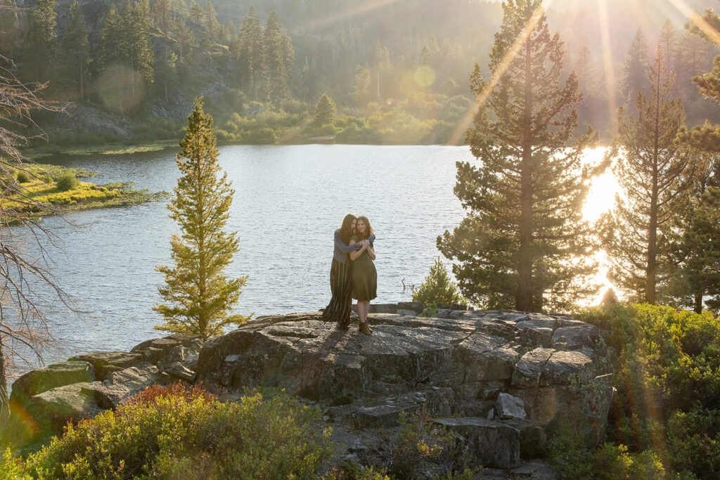 adventurous queer couple surrounded by water views during their Lake Tahoe engagement session