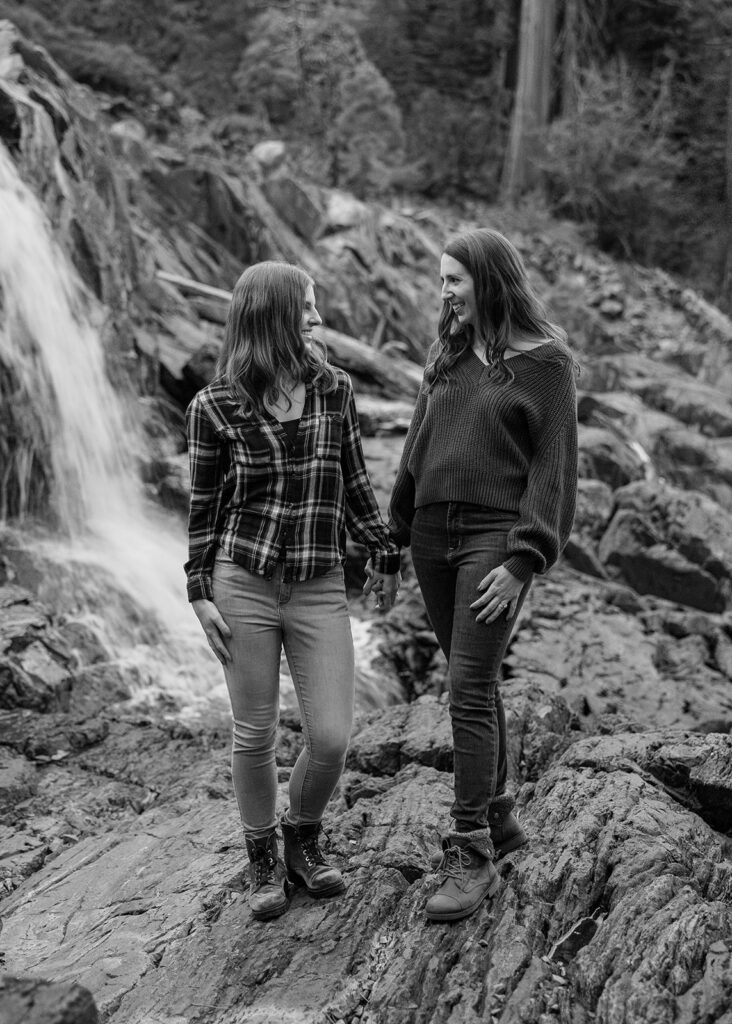 sweet queer couple during their waterfall engagement photos at glen alpine falls