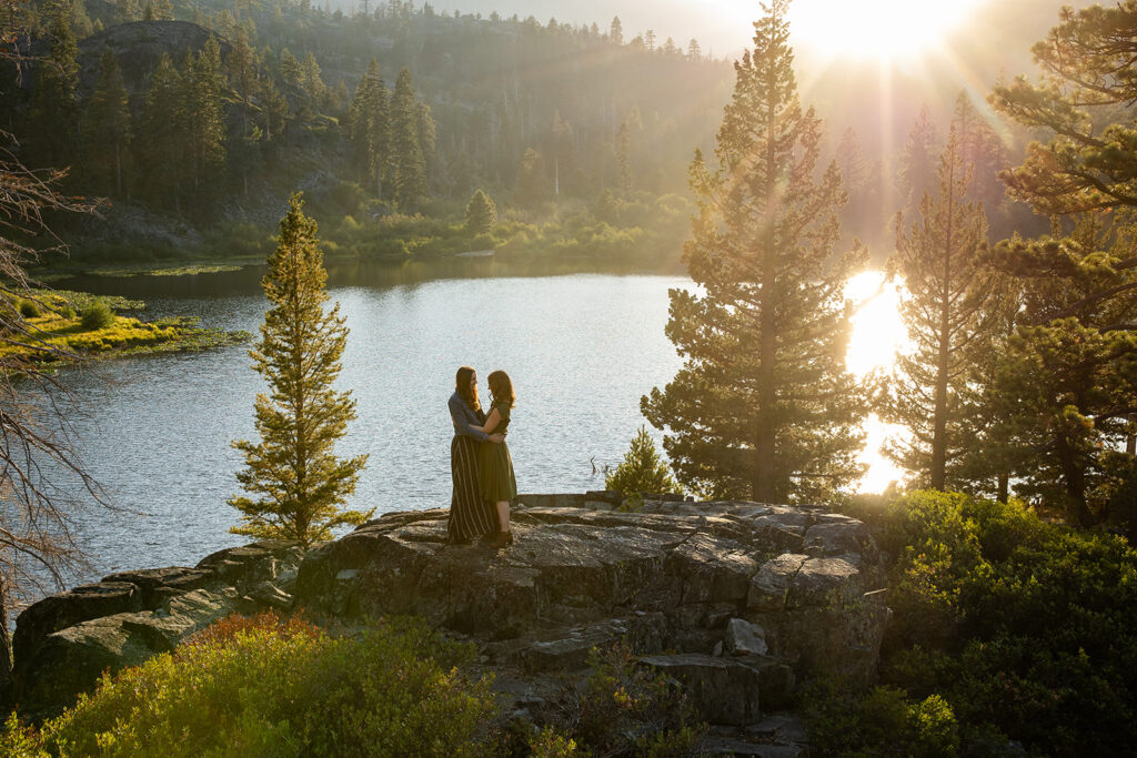 adventurous queer couple surrounded by water views during their Lake Tahoe engagement session