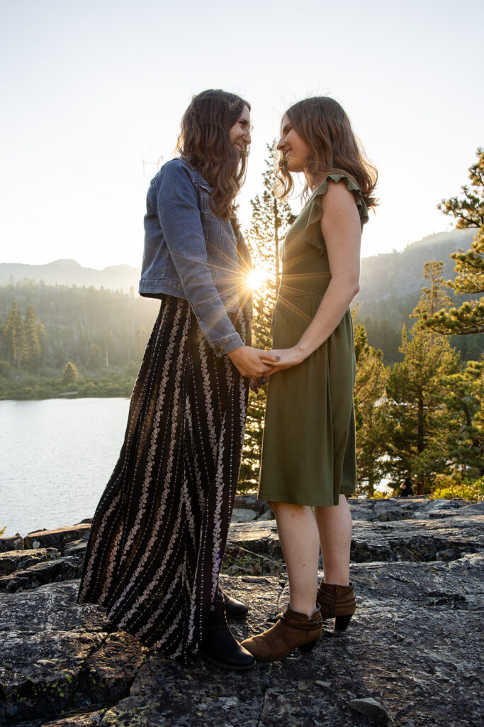 adventurous queer couple surrounded by water views during their Lake Tahoe engagement session