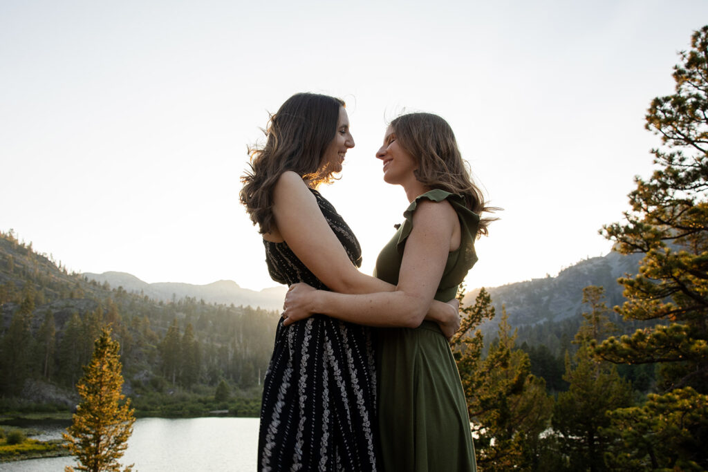 adventurous queer couple surrounded by water views during their Lake Tahoe engagement session
