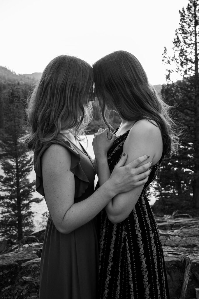 adventurous queer couple surrounded by water views during their Lake Tahoe engagement session