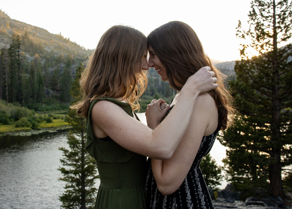 adventurous queer couple surrounded by water views during their Lake Tahoe engagement session