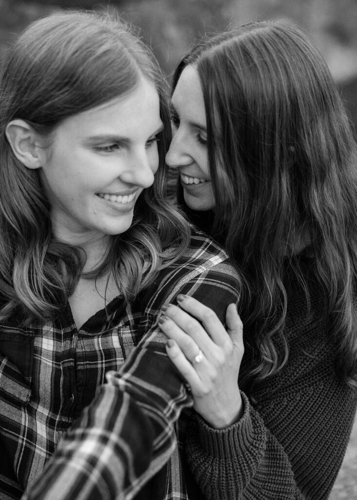 sweet queer couple during their waterfall engagement photos at glen alpine falls