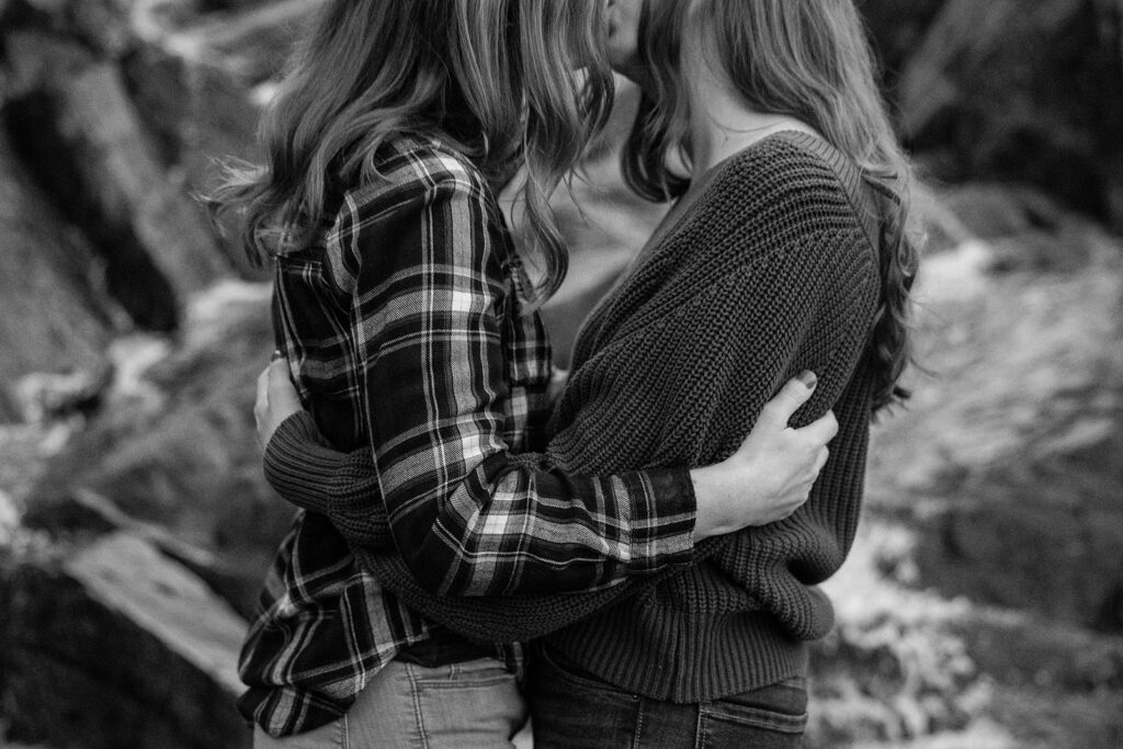 sweet queer couple during their waterfall engagement photos at glen alpine falls