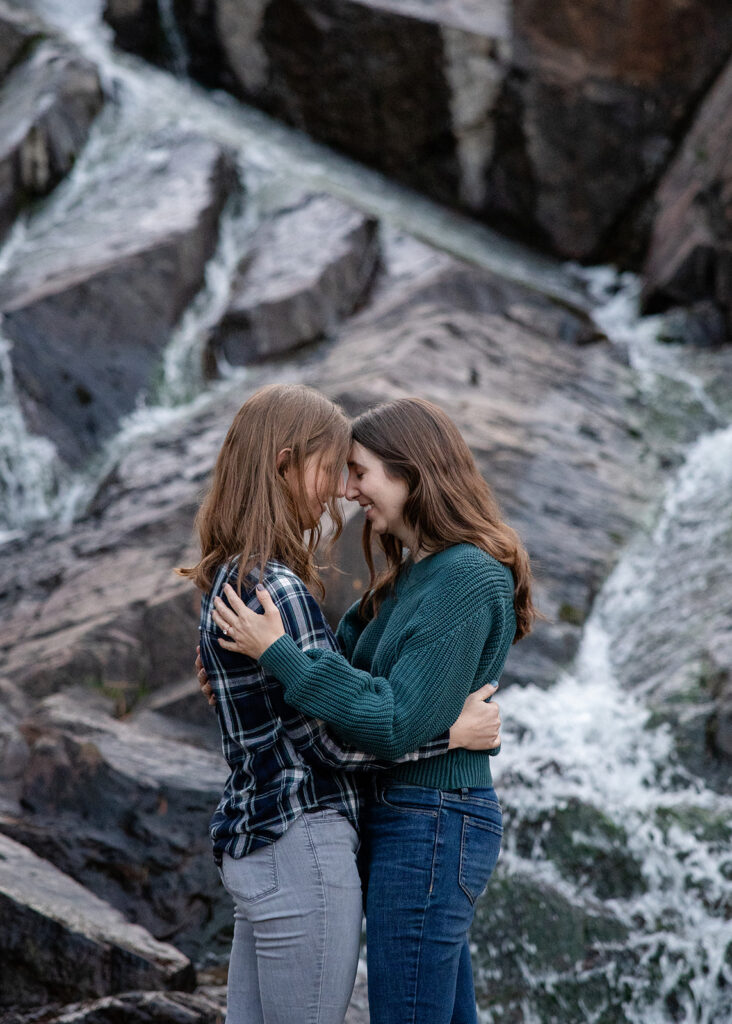 sweet queer couple during their waterfall engagement photos at glen alpine falls