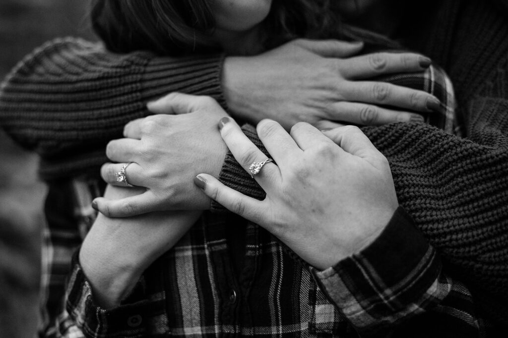 sweet queer couple during their waterfall engagement photos at glen alpine falls