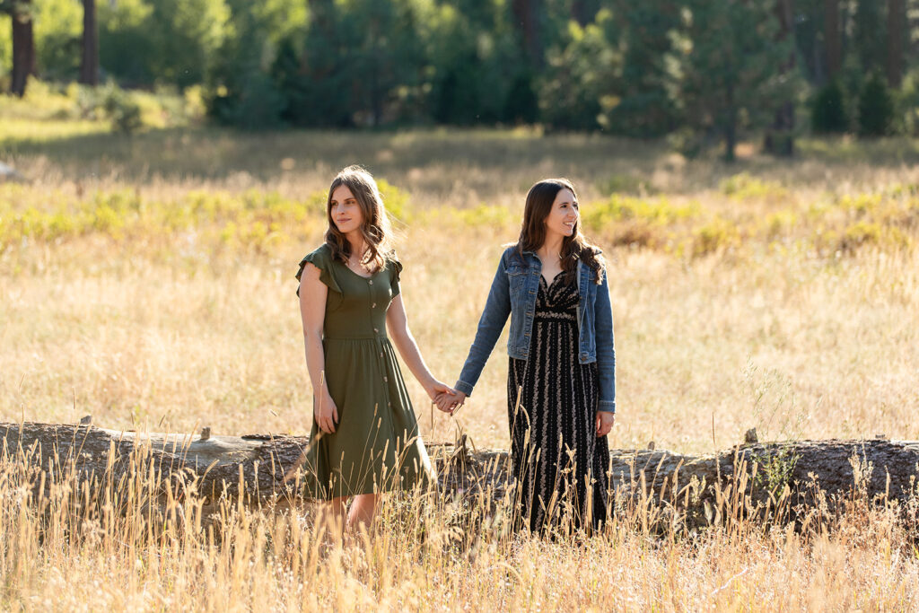sweet couple in a golden meadow in lake tahoe during their engagement photoshoot