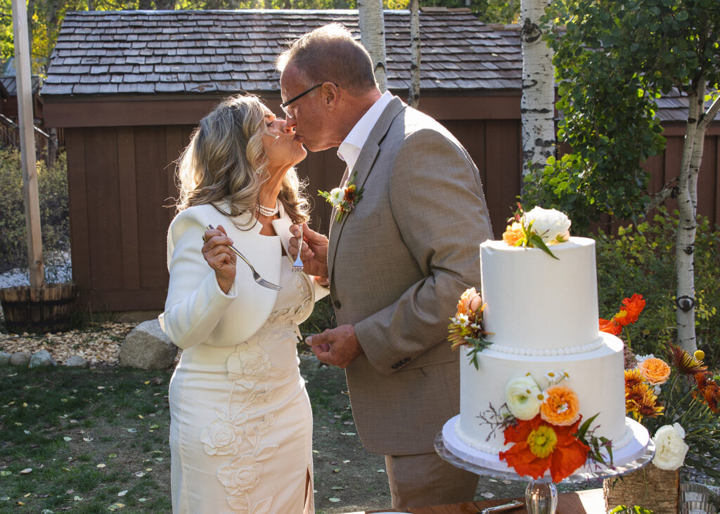 bride and groom cutting cake